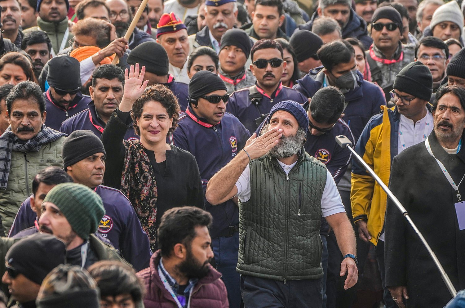  India's opposition Congress party leader Rahul Gandhi, center right and his sister and party leader Priyanka Vadra, center left, gesture toward the crowd as they walk with their supporters during a 5-month-long "Unite India March," in Srinagar, Indi