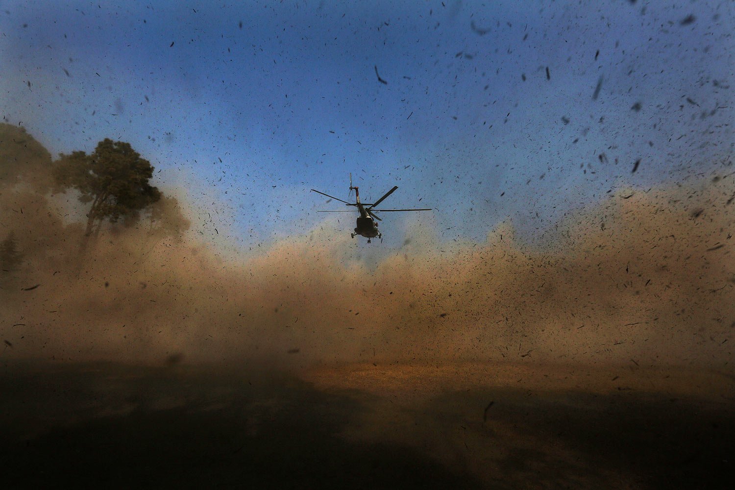  A helicopter carrying bodies of victims of a plane crash arrives in Kathmandu, Nepal, Tuesday, Jan. 17, 2023.  (AP Photo/Bikram Rai) 