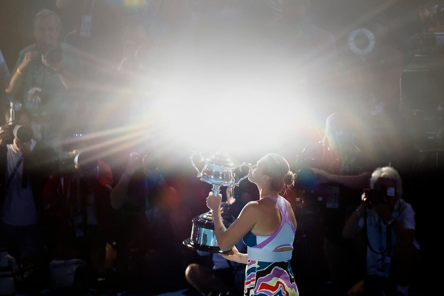  Aryna Sabalenka of Belarus kisses the Daphne Akhurst Memorial Trophy after defeating Elena Rybakina of Kazakhstan in the women's singles final at the Australian Open tennis championship in Melbourne, Australia, Saturday, Jan. 28, 2023. (AP Photo/Asa