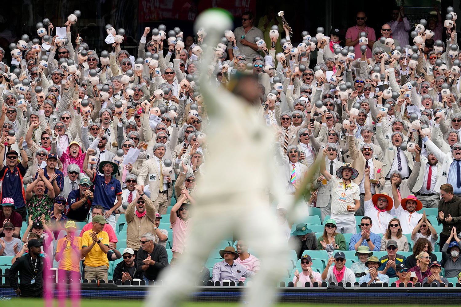  Fans known as "The Richies" cheer as Australia's Usman Khawaja celebrates with making 100 runs against South Africa during the second day of their cricket test match at the Sydney Cricket Ground in Sydney, Thursday, Jan. 5, 2023. (AP Photo/Rick Rycr