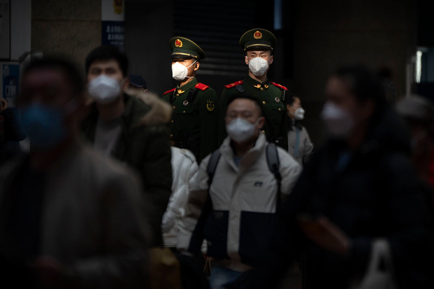  Chinese paramilitary police stand guard at Beijing West Railway Station in Beijing, Wednesday, Jan. 18, 2023.  (AP Photo/Mark Schiefelbein) 
