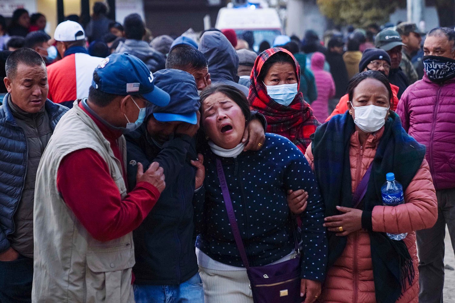  A woman cries as the body of a relative, who was a plane crash victim, is brought to a hospital in Pokhara, Nepal, Sunday, Jan. 15, 2023. (AP Photo/Yunish Gurung) 
