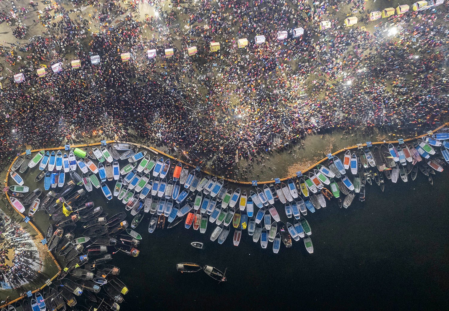  Hindu devotees crowd the Sangam, the confluence of the rivers, the Ganges, Yamuna and the mythical Saraswati, to take a holy dip on Mauni Amavsya or the new moon day, the most auspicious day during the annual month long Hindu religious fair "Magh Me