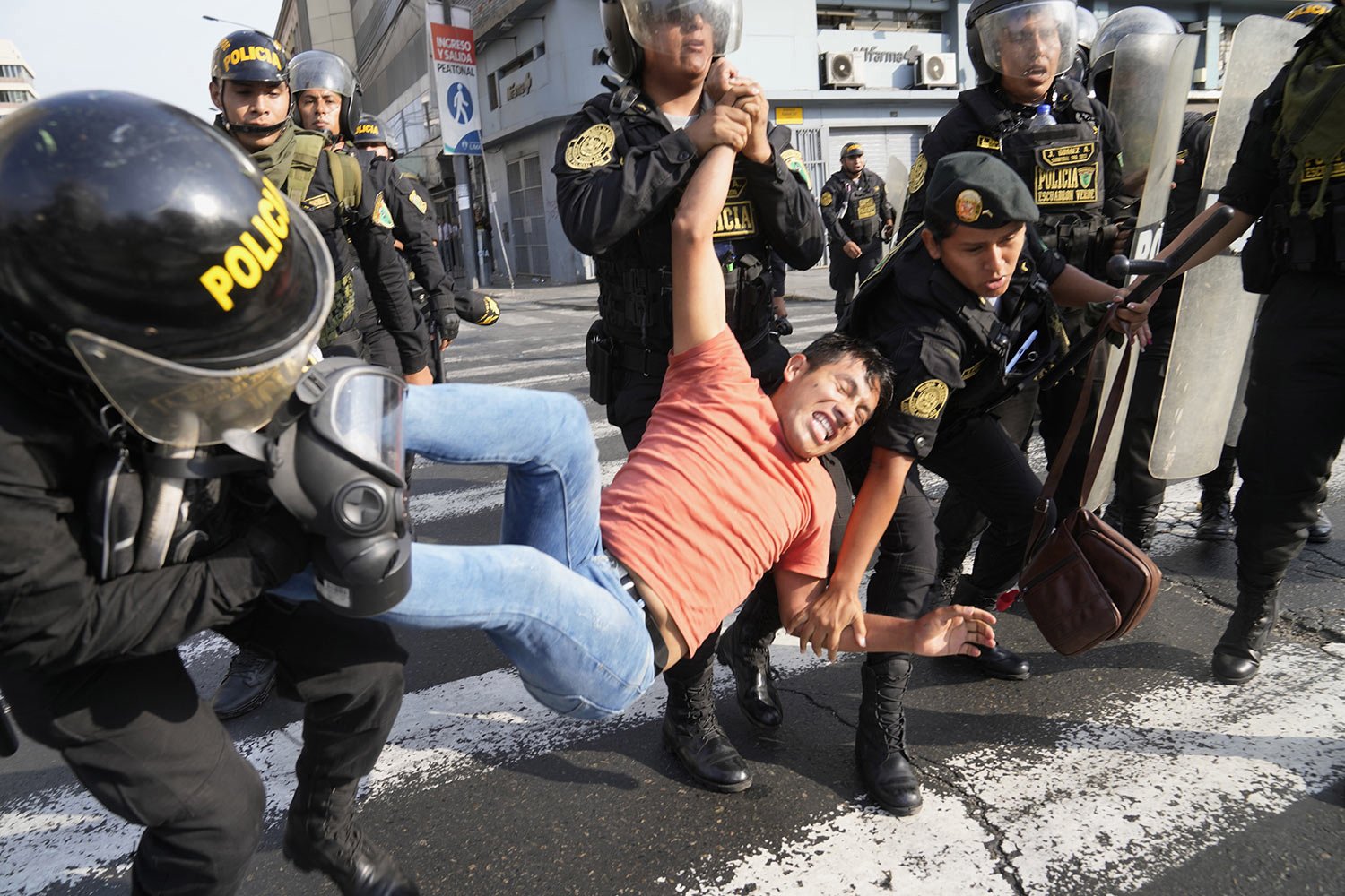  Police detain an anti-government protester during a demonstration against Peruvian President Dina Boluarte in Lima, Peru, Jan. 19, 2023. Protesters are seeking immediate elections, Boluarte's resignation, the release of ousted President Pedro Castil
