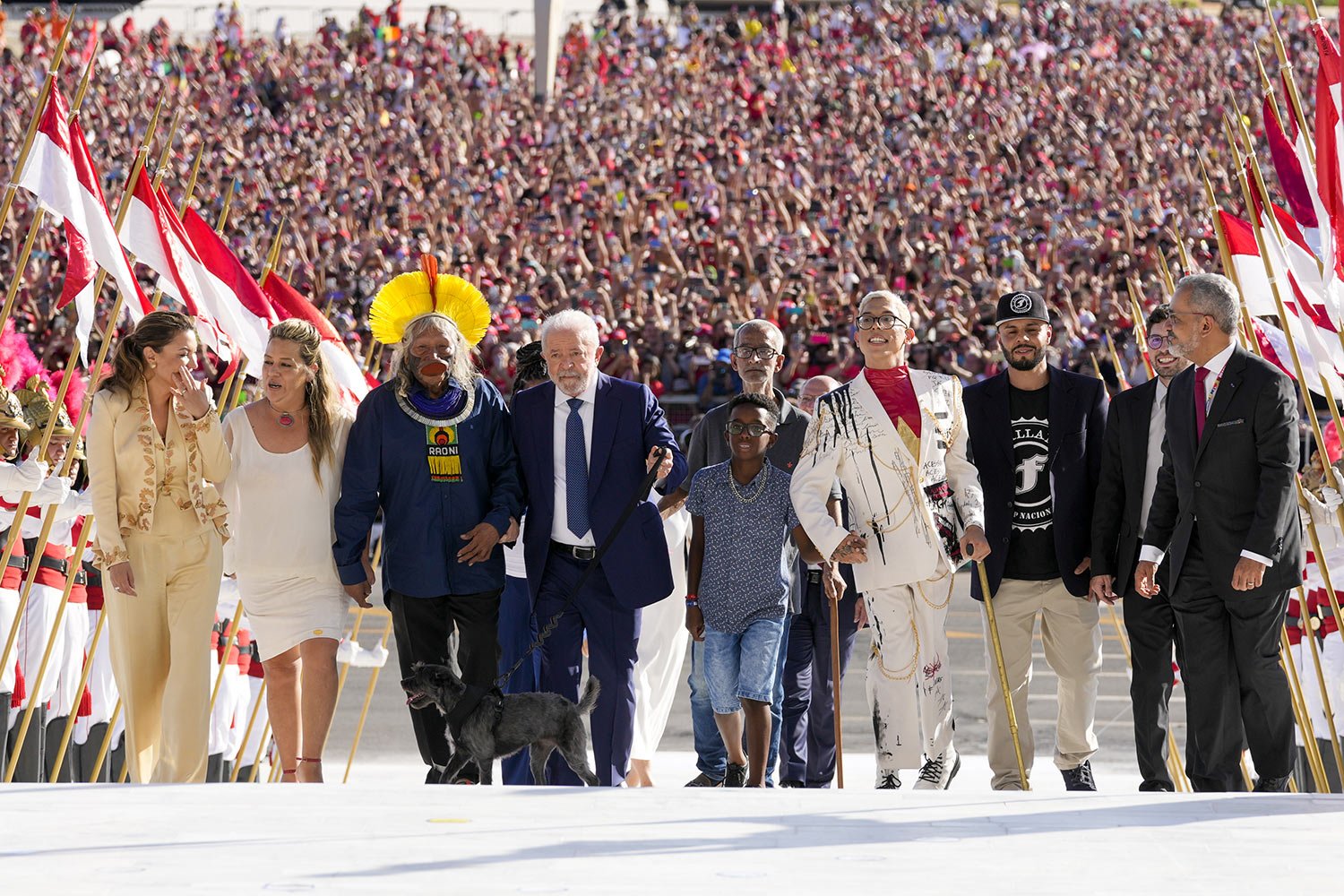  President Luiz Inacio Lula da Silva arrives to Planalto Palace with a group representing diverse segments of society after he was sworn-in on his Inauguration Day in Brasilia, Brazil, Jan. 1, 2023. (AP Photo/Eraldo Peres) 