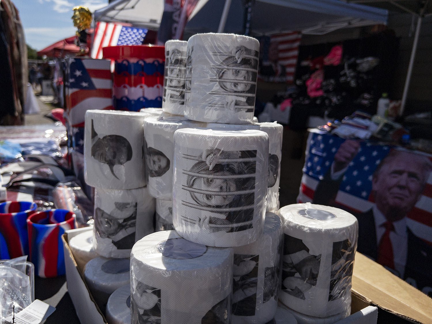  Merchandise, including toilet paper with the image of former Secretary of State Hillary Clinton behind prison bars, is displayed during the ReAwaken America Tour at Cornerstone Church in Batavia, N.Y., Aug. 13, 2022. (AP Photo/Carolyn Kaster) 