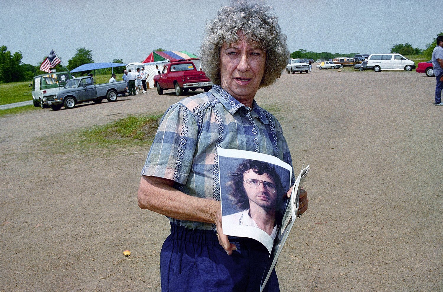  Margaret Richardson, of Waco, Texas, displays a photo of Branch Davidian cult leader David Koresh that was included in a souvenir packet that she bought on a hillside about six miles from where the cult's compound once stood in Waco, Texas on Sunday