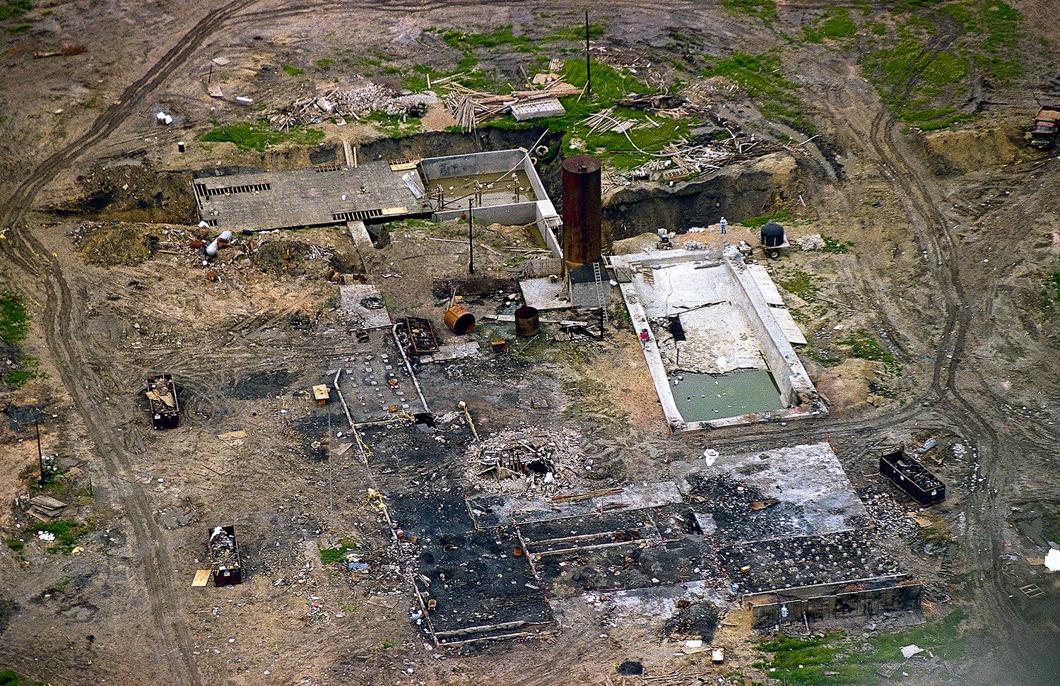  The charred remains of the Branch Davidian's 77-acre ranch are seen east of Waco, Texas, May 12, 1993. Doomsday cult leader David Koresh's apocalyptic vision came true when the fire believed set by his followers destroyed their prairie compound as f