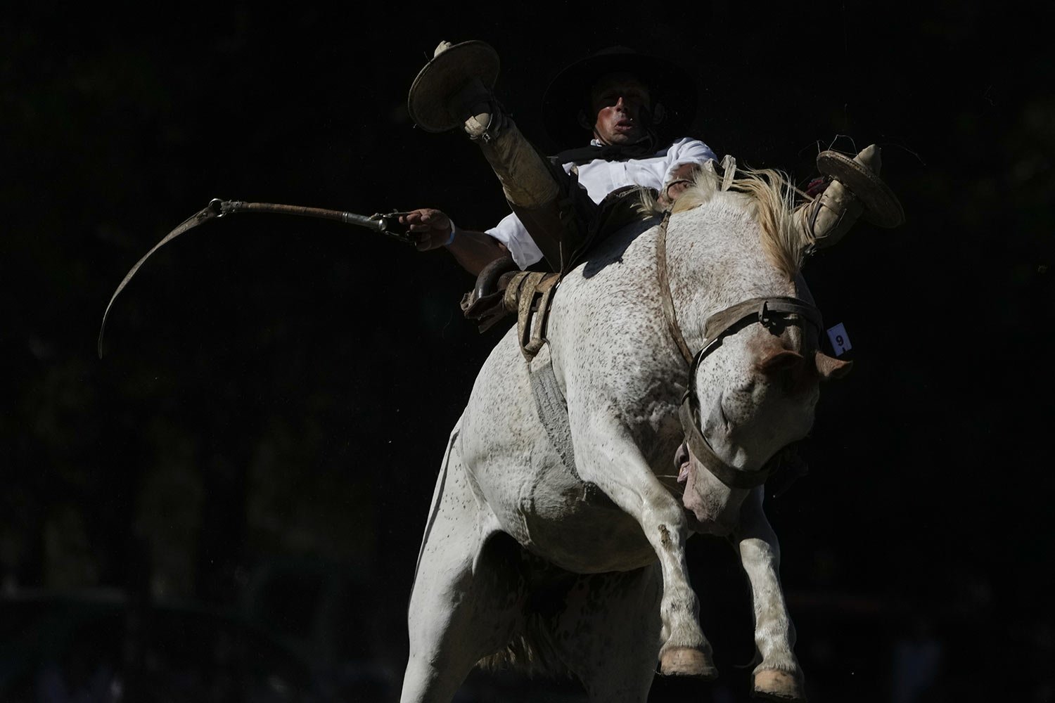  A man rides a bucking horse during a rodeo in Chascomus, Argentina, Sunday, Feb. 26, 2023. (AP Photo/Natacha Pisarenko) 