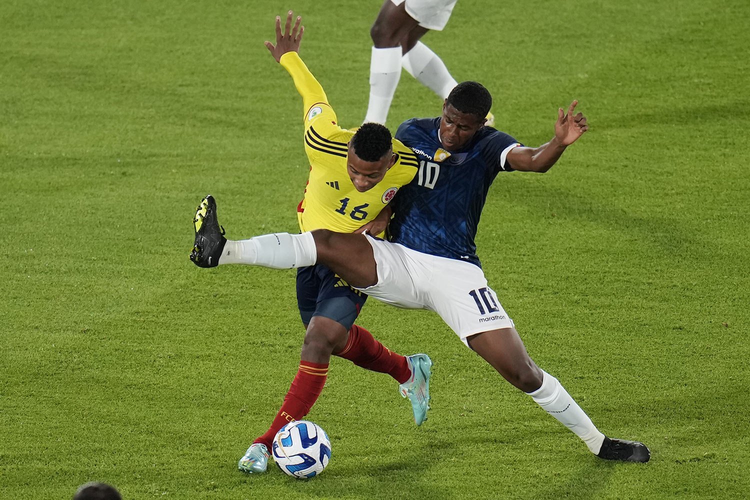  Colombia's Oscar Cortes, left, and Ecuador's Patrickson Delgado fight for the ball during a South America U-20 Championship soccer match in Bogota, Colombia, Monday, Feb. 6, 2023. (AP Photo/Fernando Vergara) 