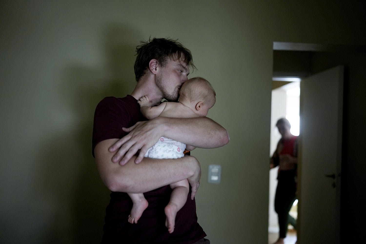 Andrei Ushakov nuzzles his Argentine-born son Lev Andres, at their home in Mendoza, Argentina, Tuesday, Feb. 14, 2023. Shortly after Russian President Vladimir Putin ordered the invasion of Ukraine, Ushakov and his wife decided to flee their Sochi, 
