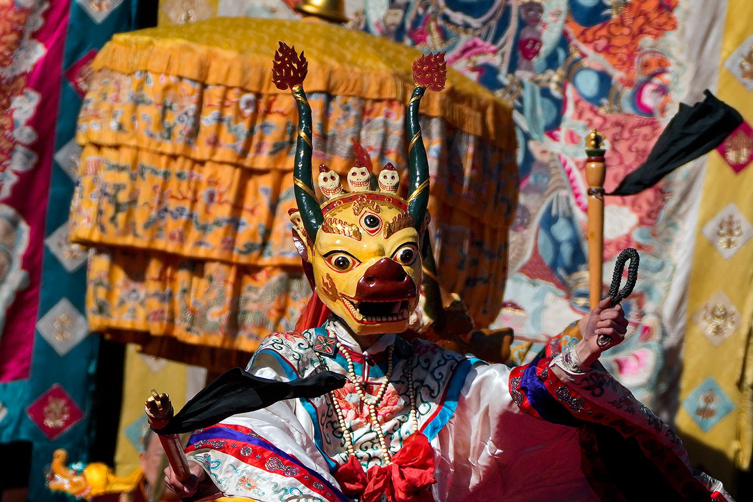  A Tibetan monk in a ghoulish costume performs during a ceremony to chase away the "demon king" to bring peace and happiness for the Tibetan New Year at the Yonghegong Lama Temple in Beijing, Sunday, Feb. 19, 2023.  (AP Photo/Andy Wong) 