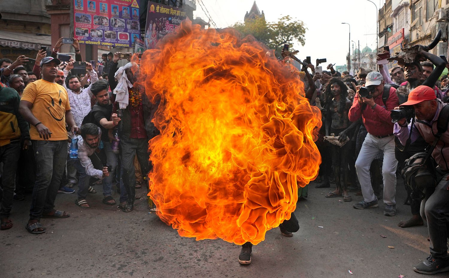  An Indian Hindu devotee demonstrates his fire breathing skills during a religious procession during Maha Shivaratri festival in Prayagraj, in the northern Indian state of Uttar Pradesh, Saturday, Feb. 18, 2023.  (AP Photo/Rajesh Kumar Singh) 