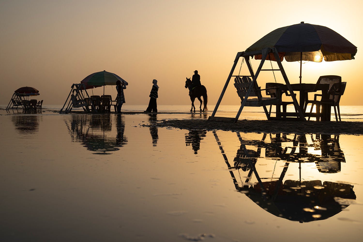  Palestinians enjoy the day on the beach during hot weather in Gaza City, Tuesday, Feb. 28, 2023. (AP Photo/Fatima Shbair) 