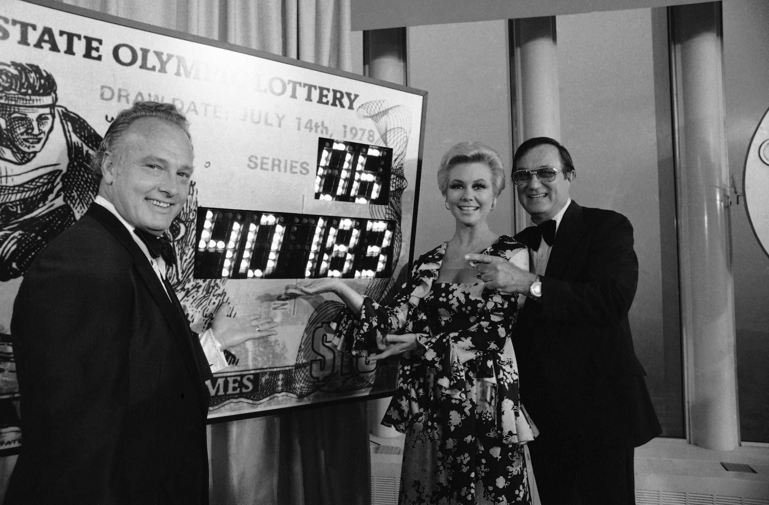  Football star Paul Hornung, left, along with actress Mitzi Gaynor and radio personality Ted Brown point to the $2 million number in the New York state Olympic lottery on Friday, July 14, 1978 at the World Trade Center in New York.     Other winning 