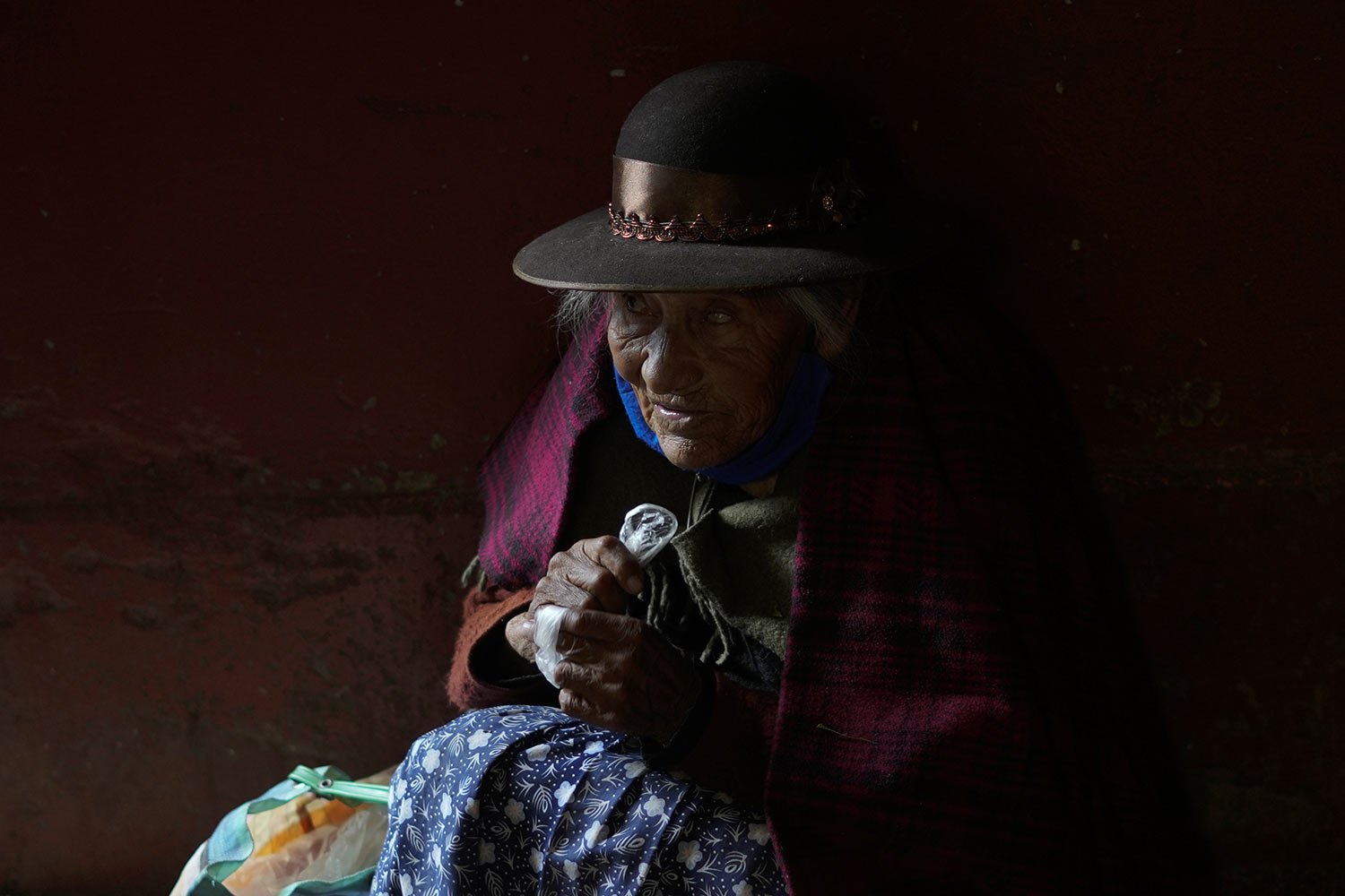  A Quechua Indigenous woman rests at the entrance of the Tupac Amaru market in Juliaca, Peru, March 10, 2023. Peruvians have found ways to manage their daily lives amid the political turmoil sparked by the removal of former President Pedro Castillo w