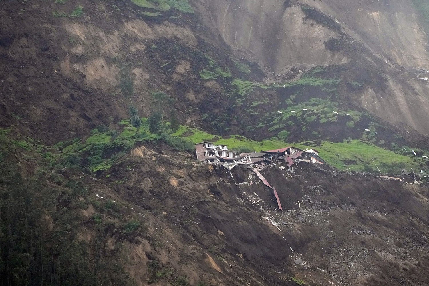  Homes are destroyed after a deadly landslide that buried dozens of homes in Alausi, Ecuador, March 27, 2023. (AP Photo/Dolores Ochoa) 