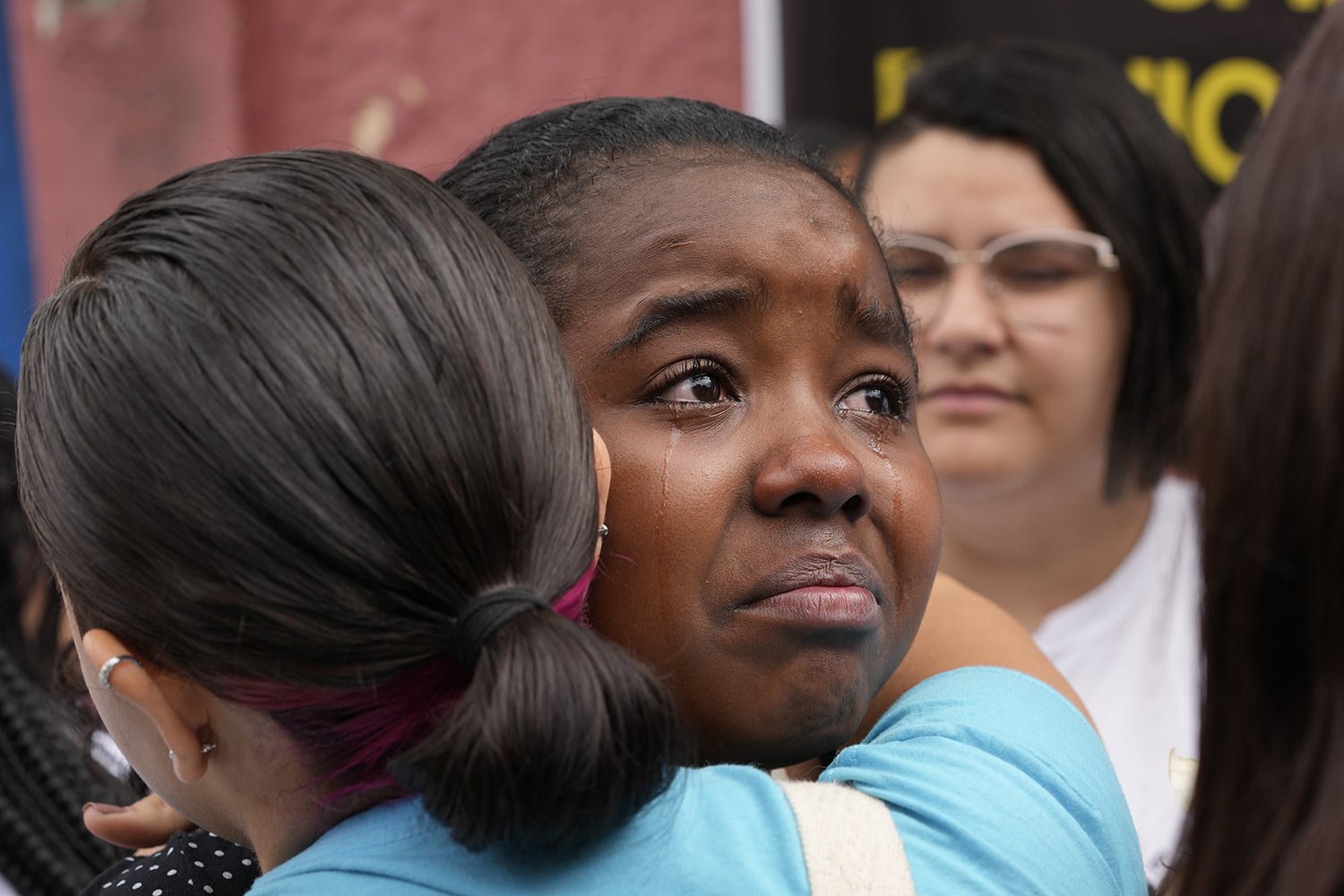  Helloisa Bastos de Carvalho, a student at the Thomazia Montoro public school, is comforted by a friend during a vigil the day after a fatal stabbing at her school in Sao Paulo, Brazil, March 28, 2023. A 13-year-old student fatally stabbed a 71-year-