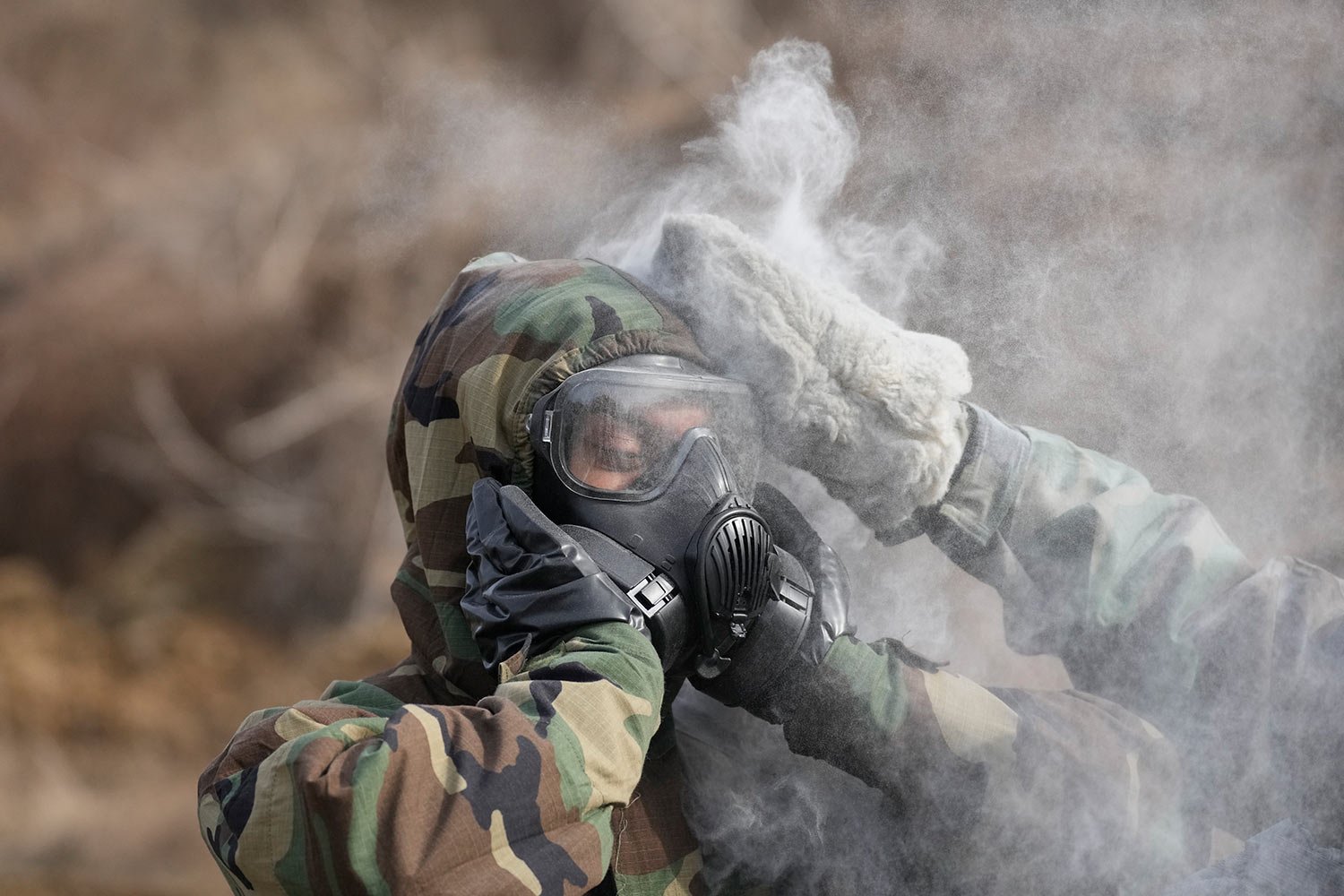  U.S. soldiers try to remove mock chemical pollutants during a joint military drill between South Korea and the United States in Paju, South Korea, Thursday, March 16, 2023.  (AP Photo/Lee Jin-man) 