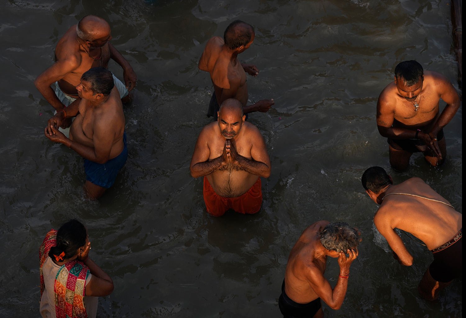  Devotees take holy dips and pray in the river Saryu on the occasion of Ramnavi festival, celebrated as the birthday of Hindu God Rama, in Ayodhya, India, Thursday, March 30, 2023. (AP Photo/Manish Swarup) 