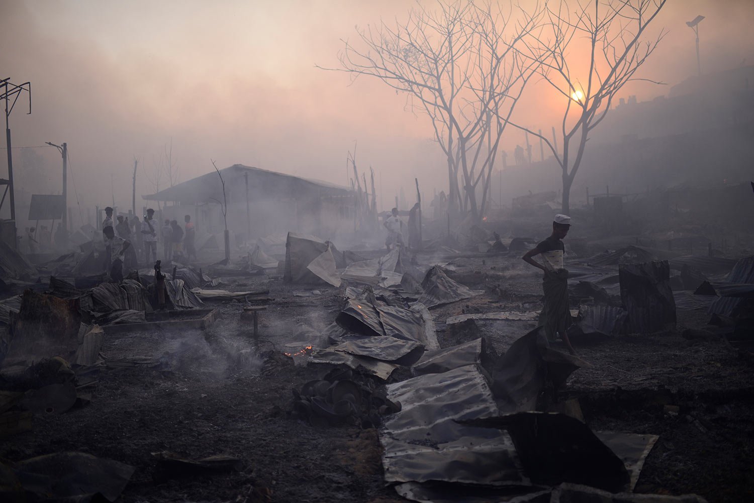  Rohingya refugees try to salvage their belongings after a major fire in their Balukhali camp at Ukhiya in Cox's Bazar district, Bangladesh, Sunday, March 5, 2023.  (AP Photo/Mahmud Hossain Opu) 