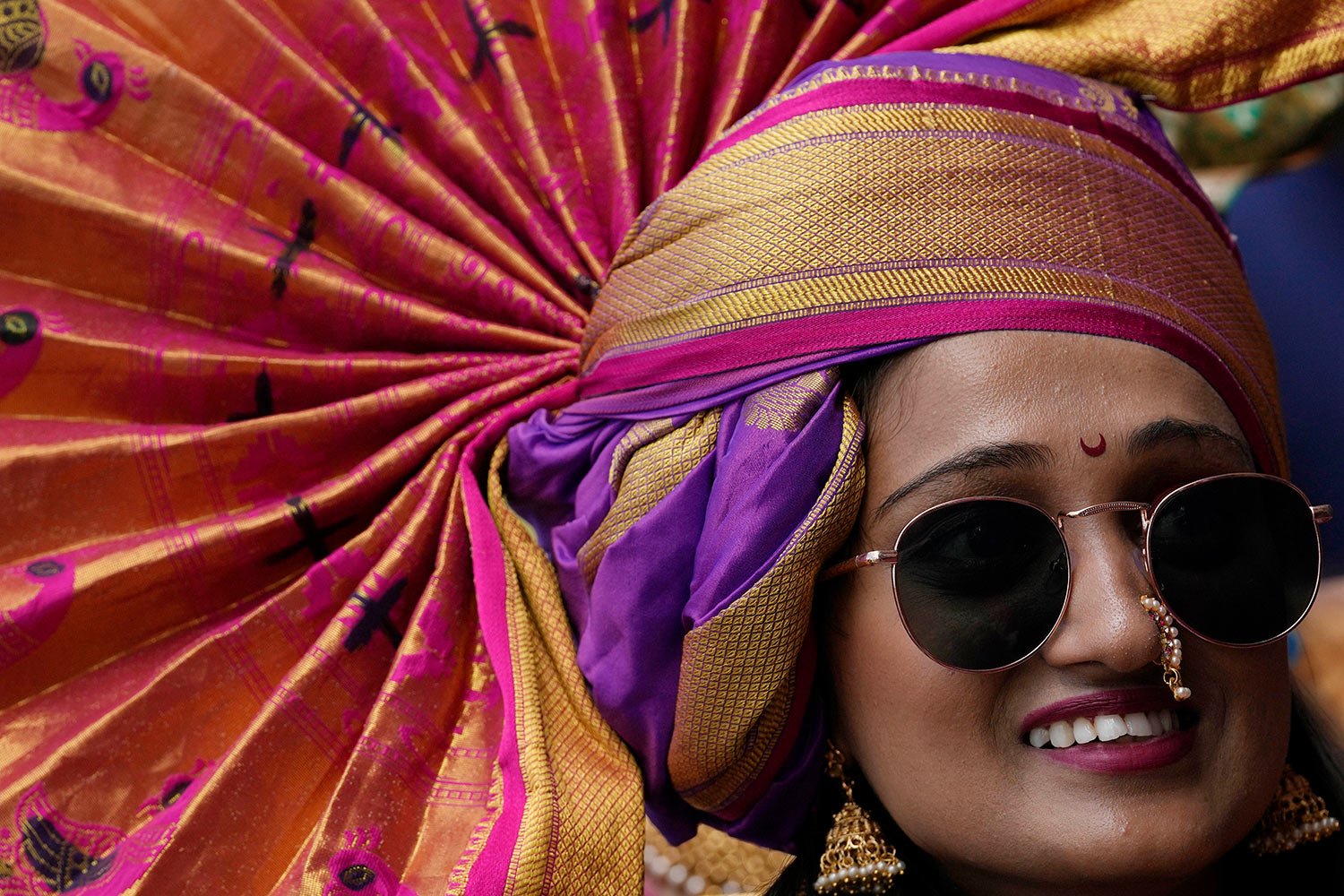  An Indian woman dressed in traditional attire participates in a procession to mark Gudi Padwa or the Marathi New Year in Mumbai, Maharashtra state, India, Wednesday, March 22, 2023. (AP Photo/Rajanish Kakade) 