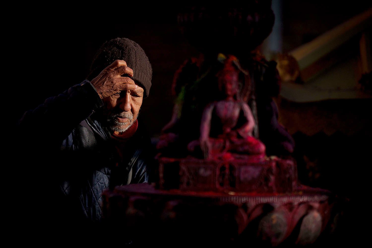  A man offers a prayer to a staute of Lord Buddha in Lalitpur, Nepal, Monday, March 27, 2023. (AP Photo/Niranjan Shrestha) 