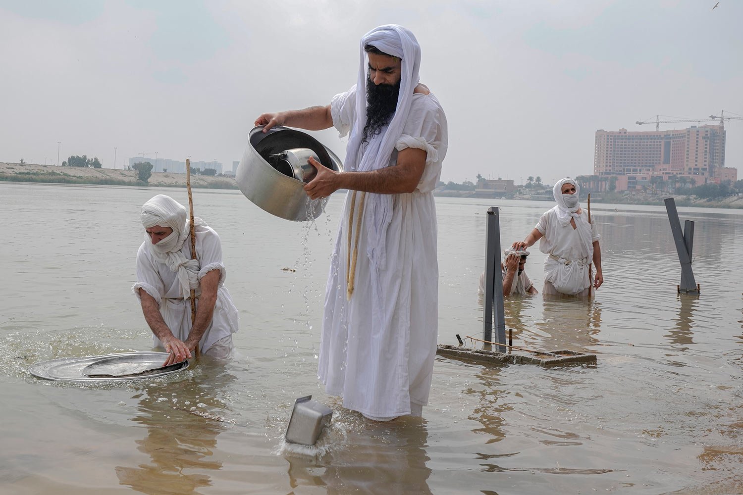  Followers of the Sabean Mandaeans faith, a pre-Christian sect that follows the teachings of the Bible's John the Baptist, perform their rituals in the Tigris River during a celebration marking "Banja" or Creation Feast, in central Baghdad, Iraq, Tue