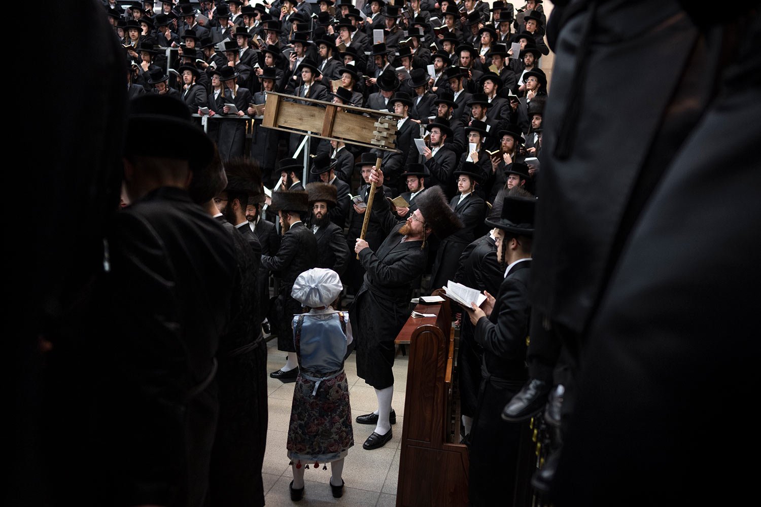  Jewish ultra-Orthodox men and children, some wearing costumes read the Book of Esther, which tells the story of the Jewish festival of Purim, at a synagogue in Bnei Brak, Israel, Monday, March 6, 2023. (AP Photo/Oded Balilty) 
