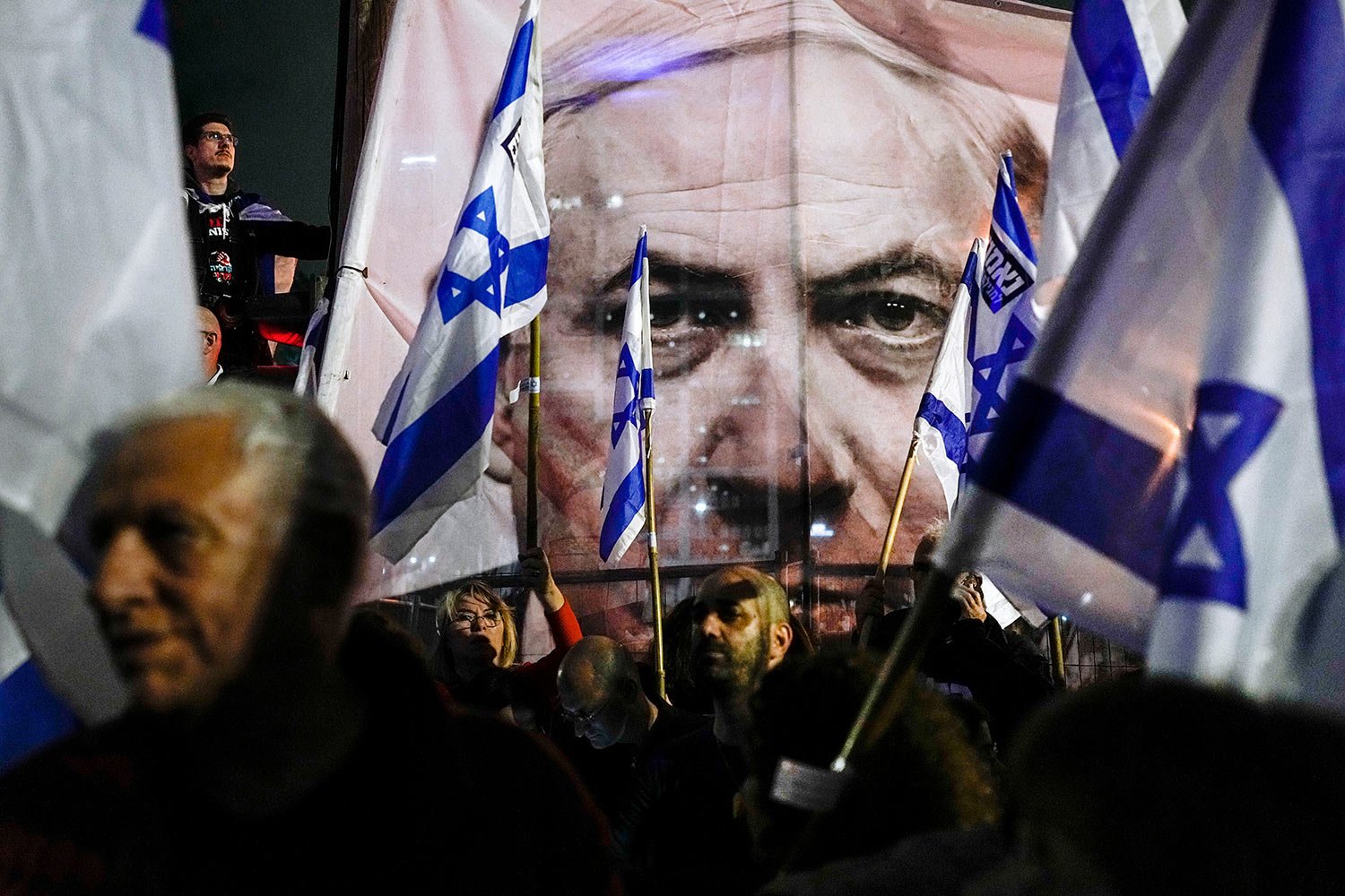  Israelis protest against plans by Prime Minister Benjamin Netanyahu's government to overhaul the Israel's judicial system, in Tel Aviv, Israel, Saturday, March 18, 2023. (AP Photo/Ohad Zwigenberg) 