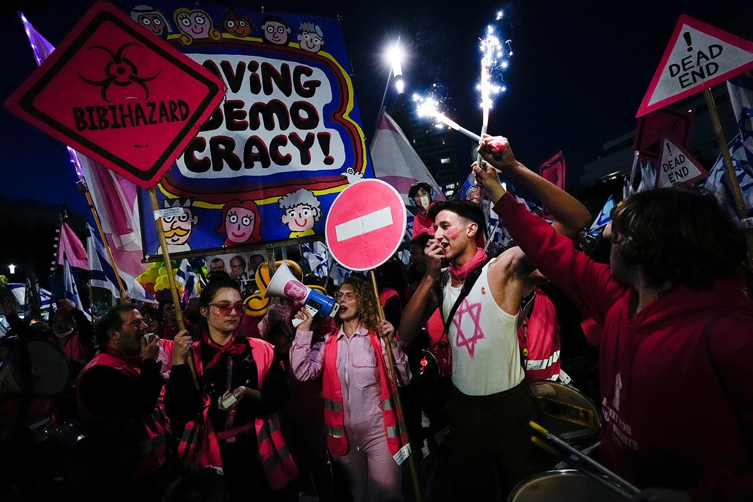  Israelis protest against plans by Prime Minister Benjamin Netanyahu's government to overhaul the judicial system, in Tel Aviv, Israel, Saturday, March 18, 2023. (AP Photo/Ohad Zwigenberg) 