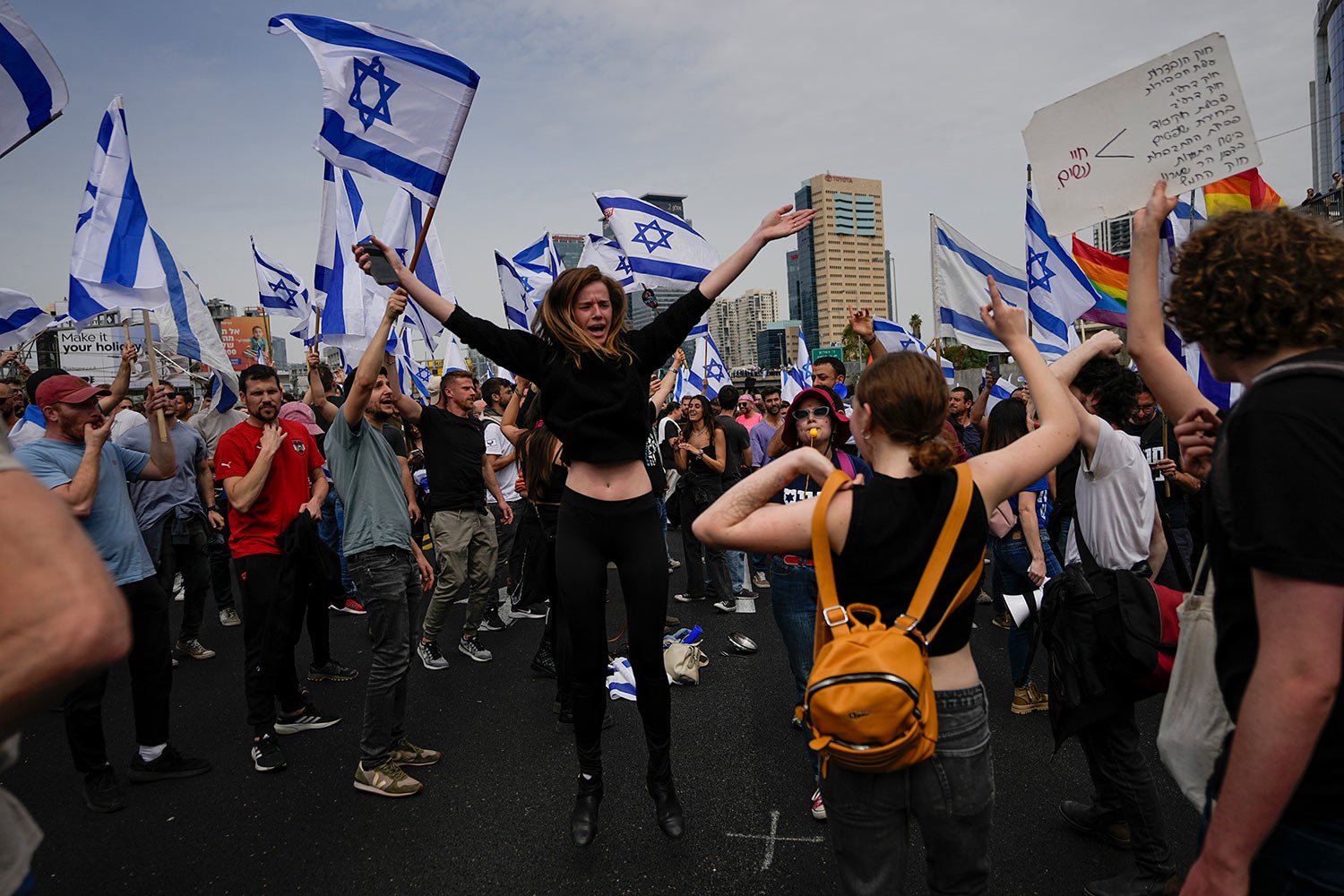  Demonstrators block a highway during protest against plans by Prime Minister Benjamin Netanyahu's government to overhaul the judicial system in Tel Aviv, Israel, Thursday, March 23, 2023. (AP Photo/Ohad Zwigenberg) 