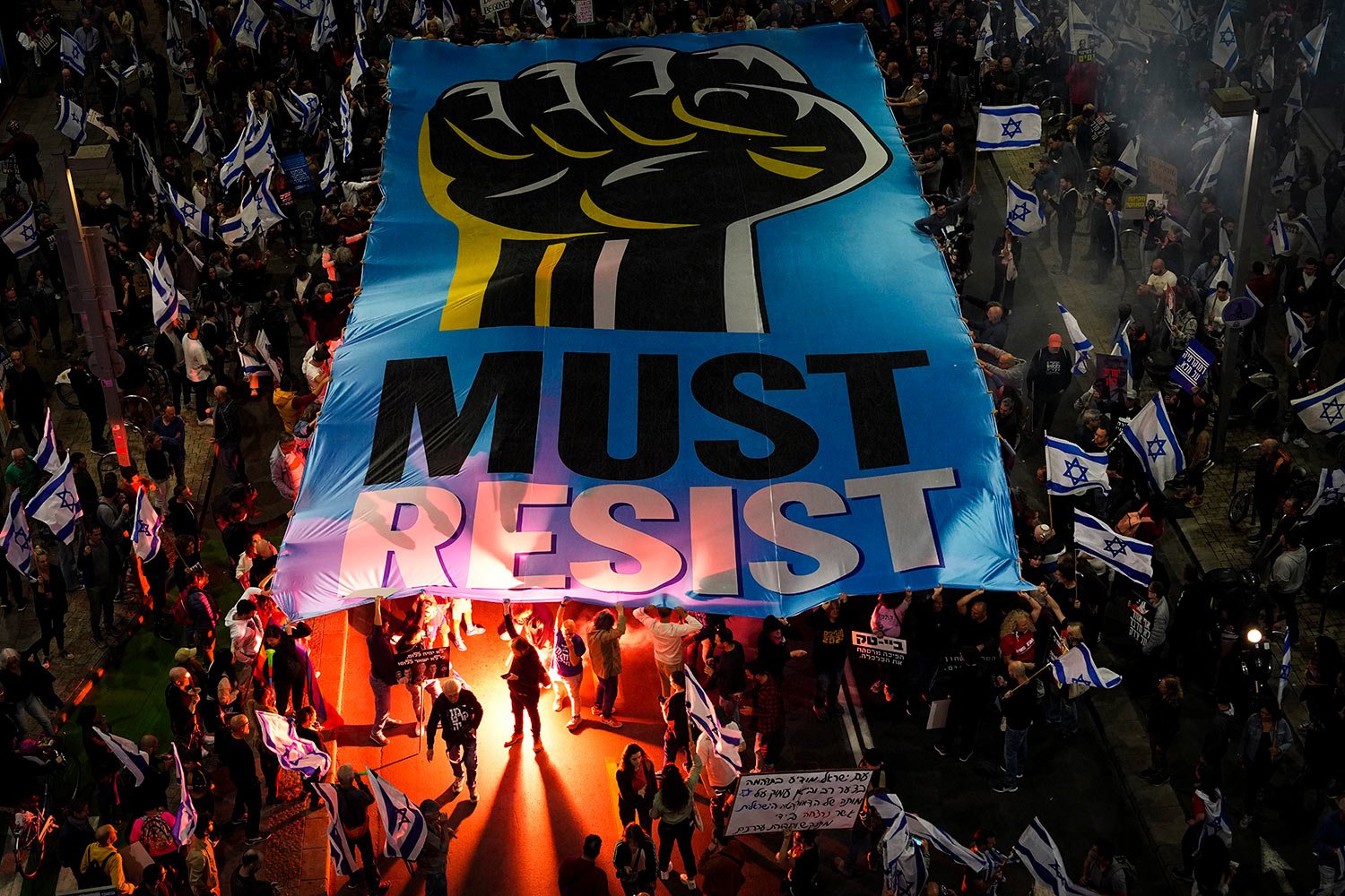  Israelis protest against plans by Prime Minister Benjamin Netanyahu's new government to overhaul the judicial system, in Tel Aviv, Israel, Saturday, March 4, 2023. (AP Photo/Tsafrir Abayov) 