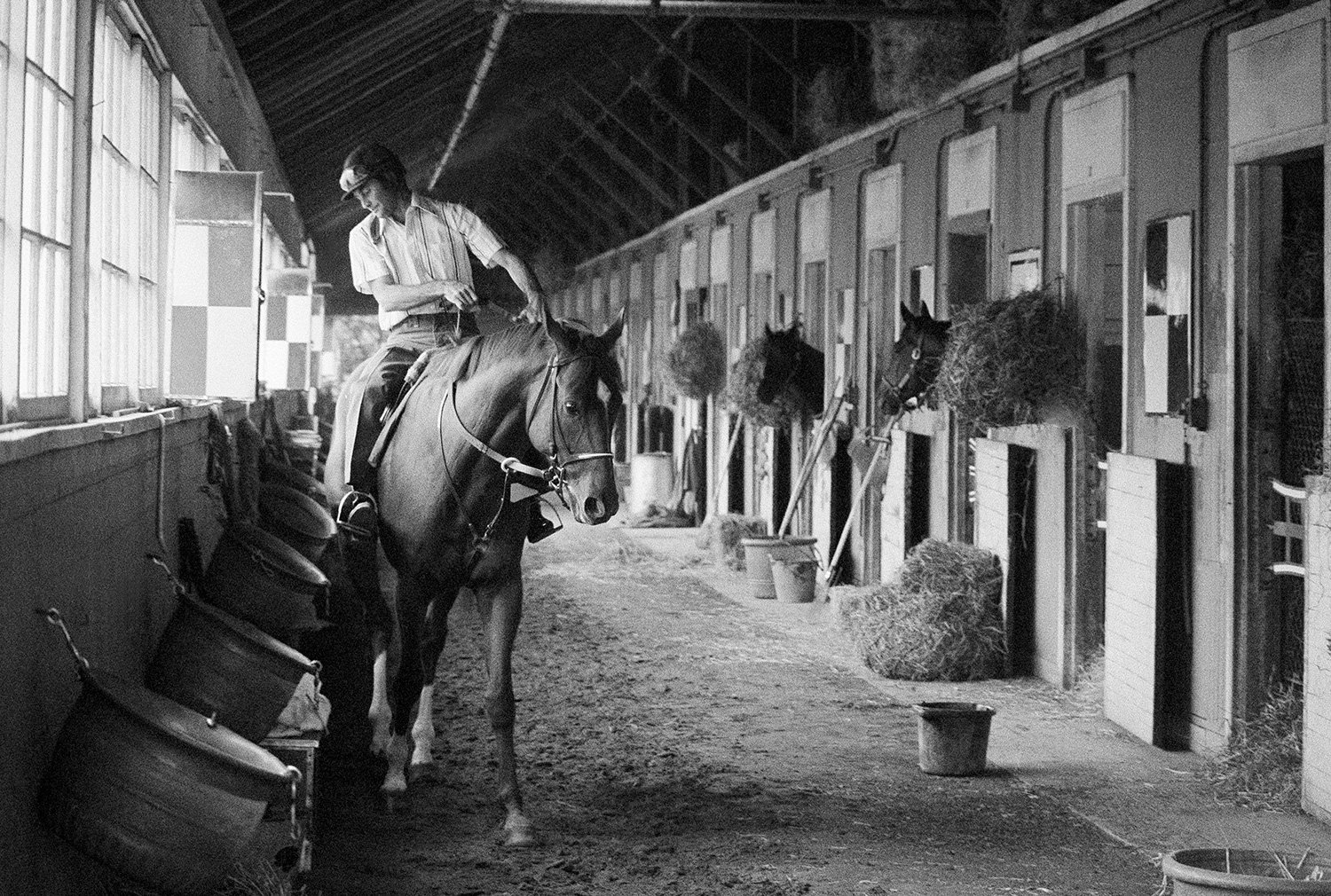  With his sights set for victory in the June 9 Belmont Stakes to capture the Triple Crown, Secretariat works out with an exercise rider in the shed row at Belmont Park in Elmont, N.Y., May 23, 1973. The horse loosened up indoors to avoid rainy weathe