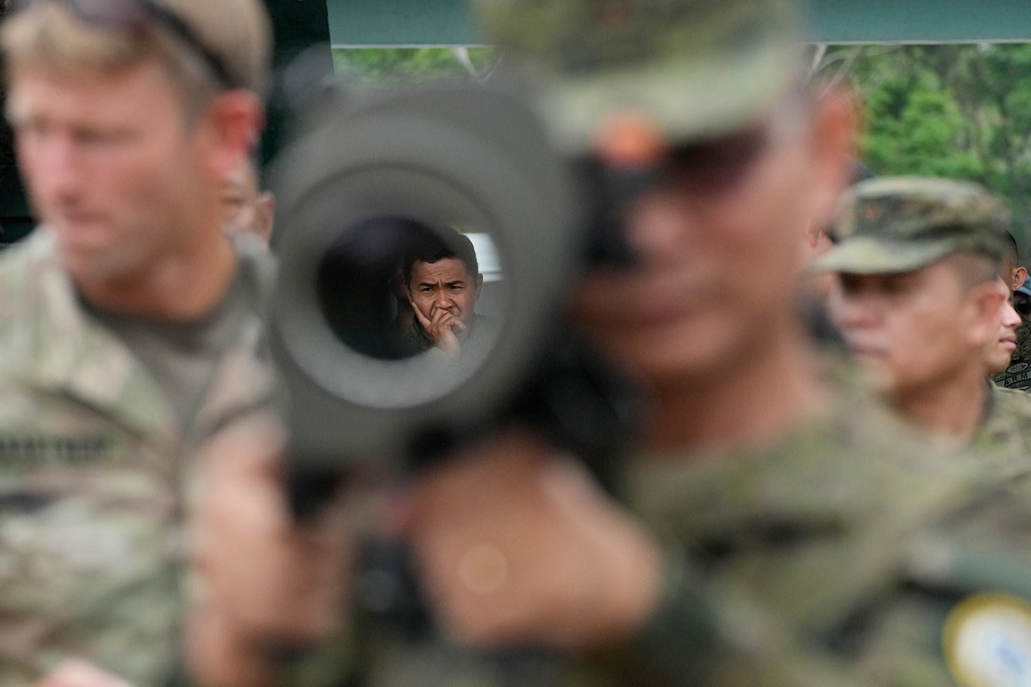  A Filipino soldier is seen through the barrel of a Carl Gustaf recoilless anti-tank rifle during a joint military exercise between the U.S, and Philippines called "Balikatan," Tagalog for shoulder-to-shoulder at Fort Magsaysay, Nueva Ecija province,