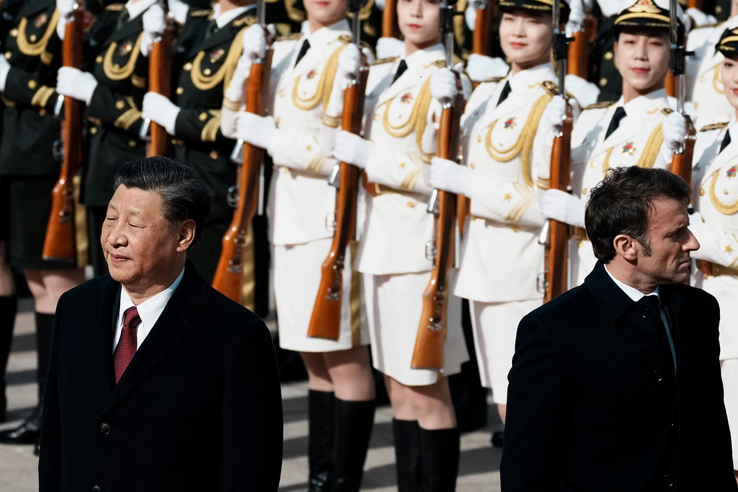  Chinese President Xi Jinping, left, and France's President Emmanuel Macron review troops during a welcome ceremony at the Great Hall of the People in Beijing, China, April 6, 2023.  (AP Photo/Thibault Camus) 