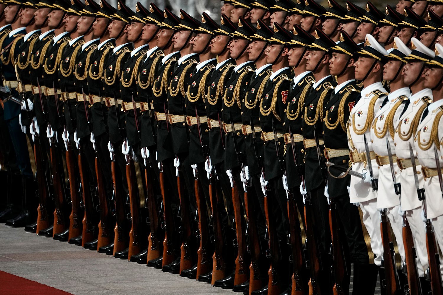  Chinese honor guard members stand as they wait for the start of the welcome ceremony of France's President Emmanuel Macron at the Great Hall of the People in Beijing, China, Thursday, April 6, 2023. (AP Photo/Thibault Camus) 