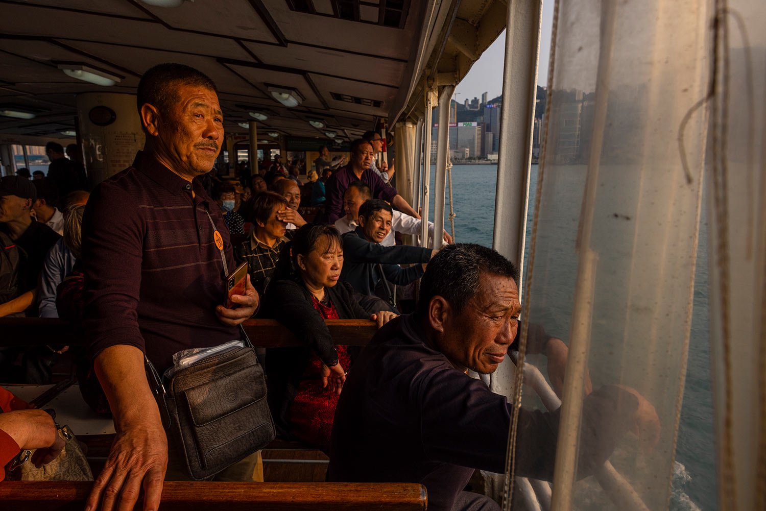  Mainland Chinese tourists ride the Star Ferry in Hong Kong, Wednesday, April 12, 2023. (AP Photo/Louise Delmotte) 