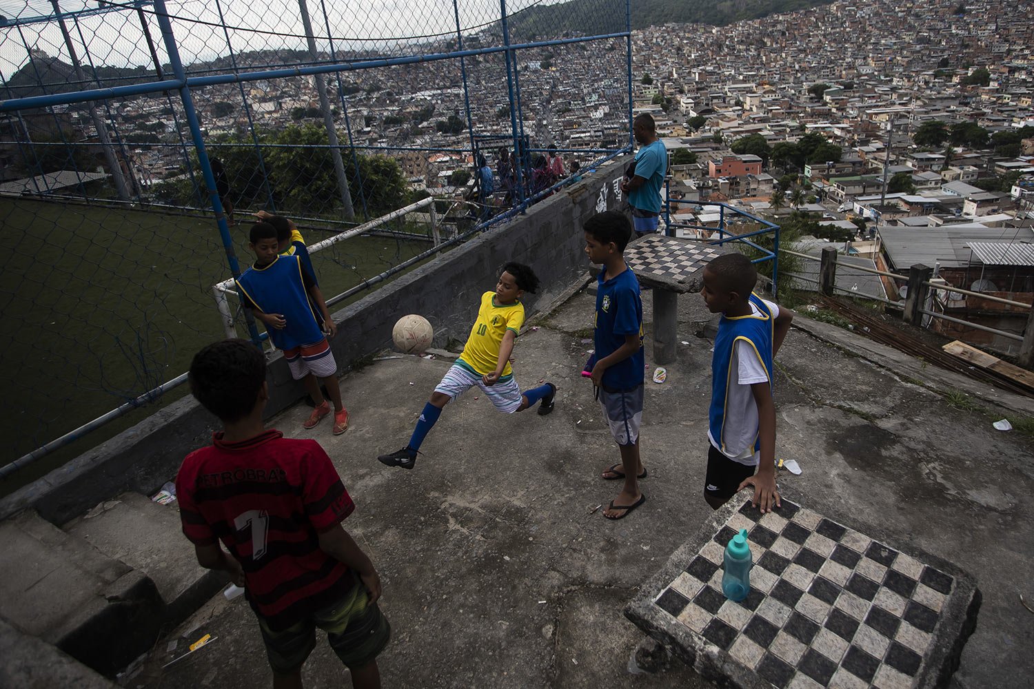 Boys play soccer as they wait for a street soccer training program run by the Street Child United Brazil organization in the Complexo da Penha favela of Rio de Janeiro, Brazil, April 29, 2023. (AP Photo/Bruna Prado) 