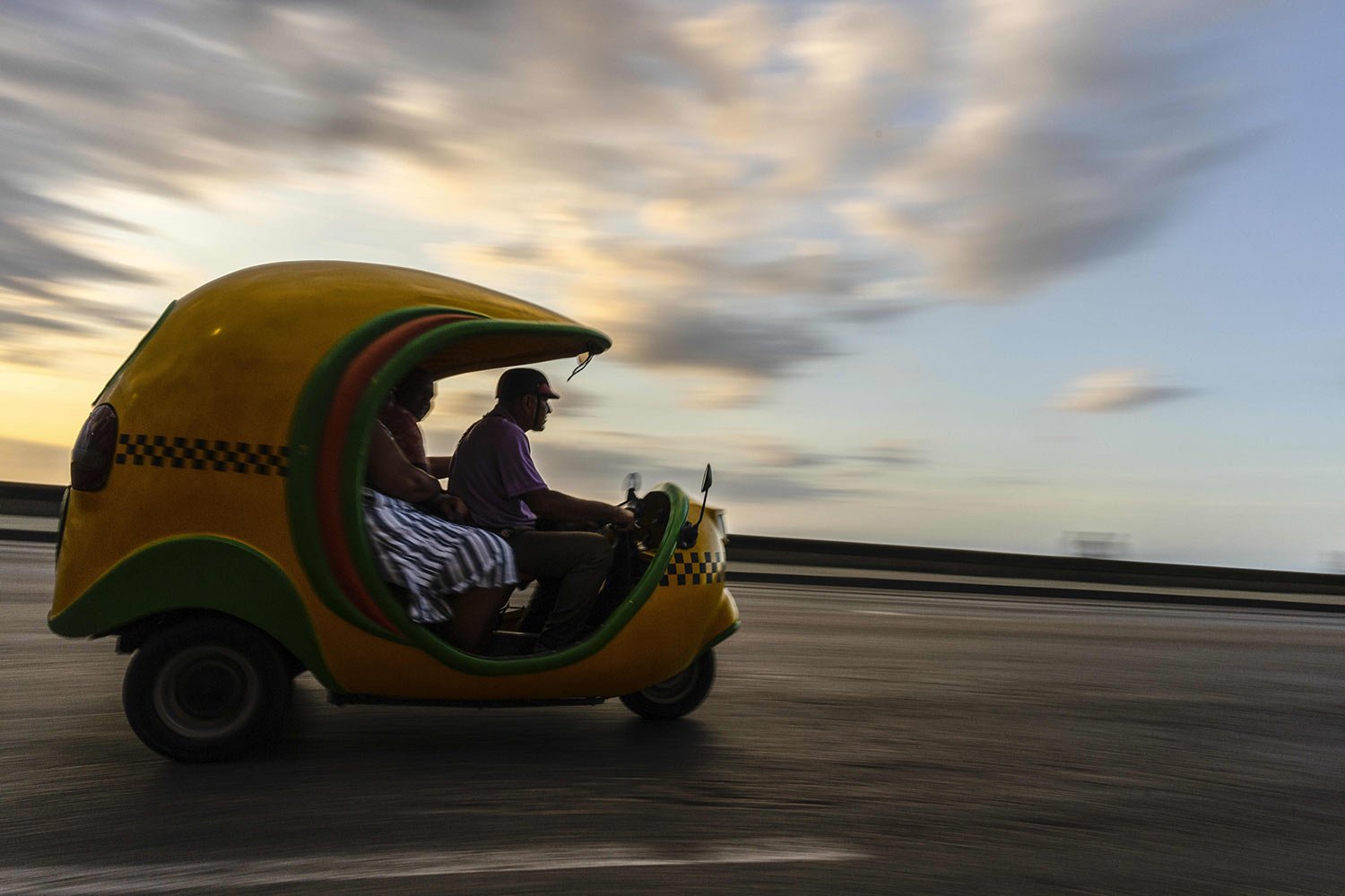  Residents use a Coco taxi that’s normally used by tourists in Havana, Cuba, April 6, 2023. (AP Photo/Ramon Espinosa) 