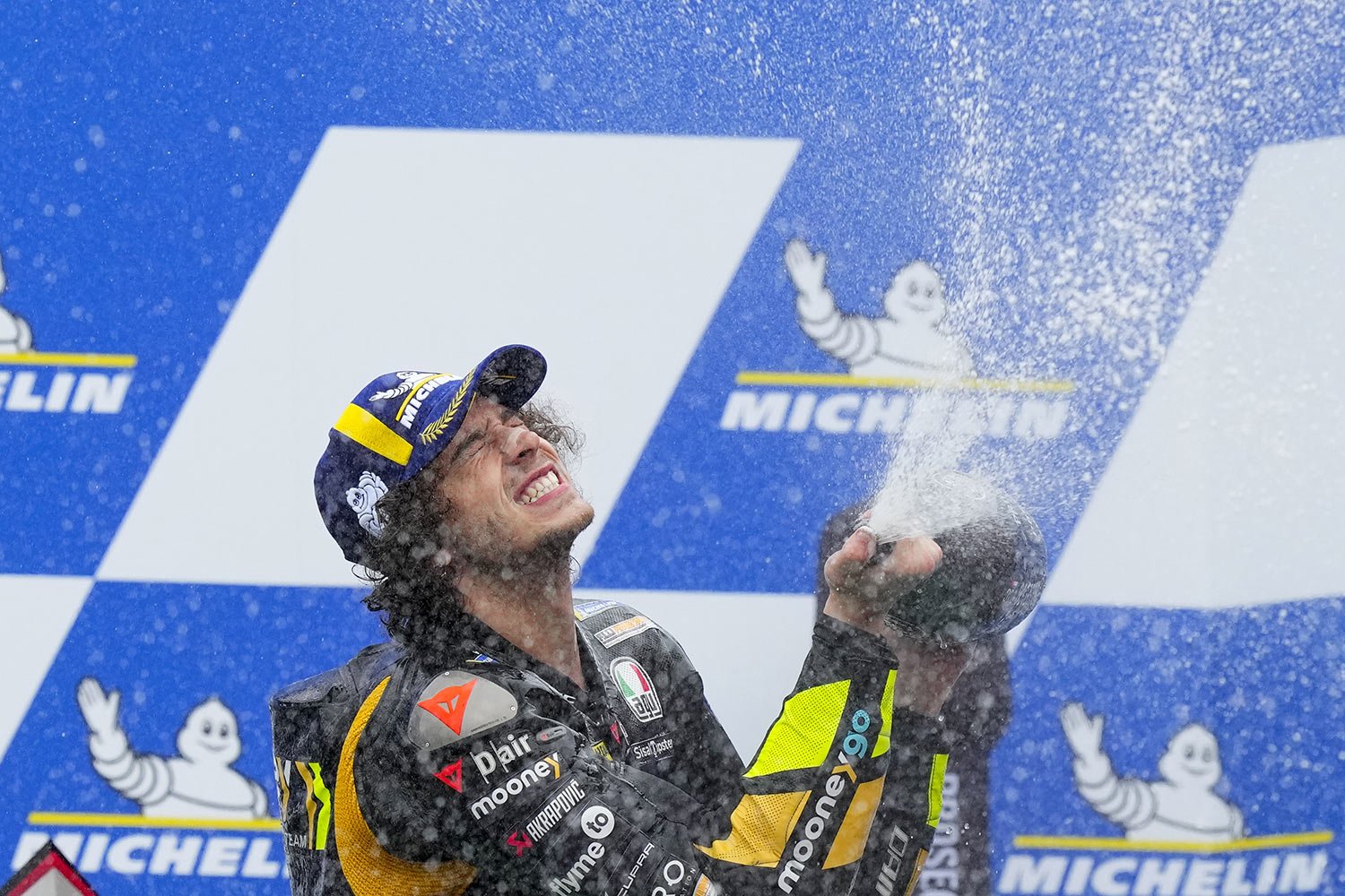  Italy's Marco Bezzecchi celebrates on the podium after winning the Moto GP race for the Ducati Mooney VR46 Racing team in Termas de Rio Hondo, Argentina, April 2, 2023. (AP Photo/Natacha Pisarenko) 