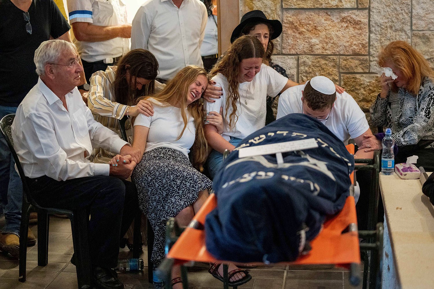  Mourners attend the funeral of two British-Israeli sisters, Maia and Rina Dee, at a cemetery in the West Bank Jewish settlement of Kfar Etzion, Sunday, April 9, 2023.  (AP Photo/Ohad Zwigenberg) 