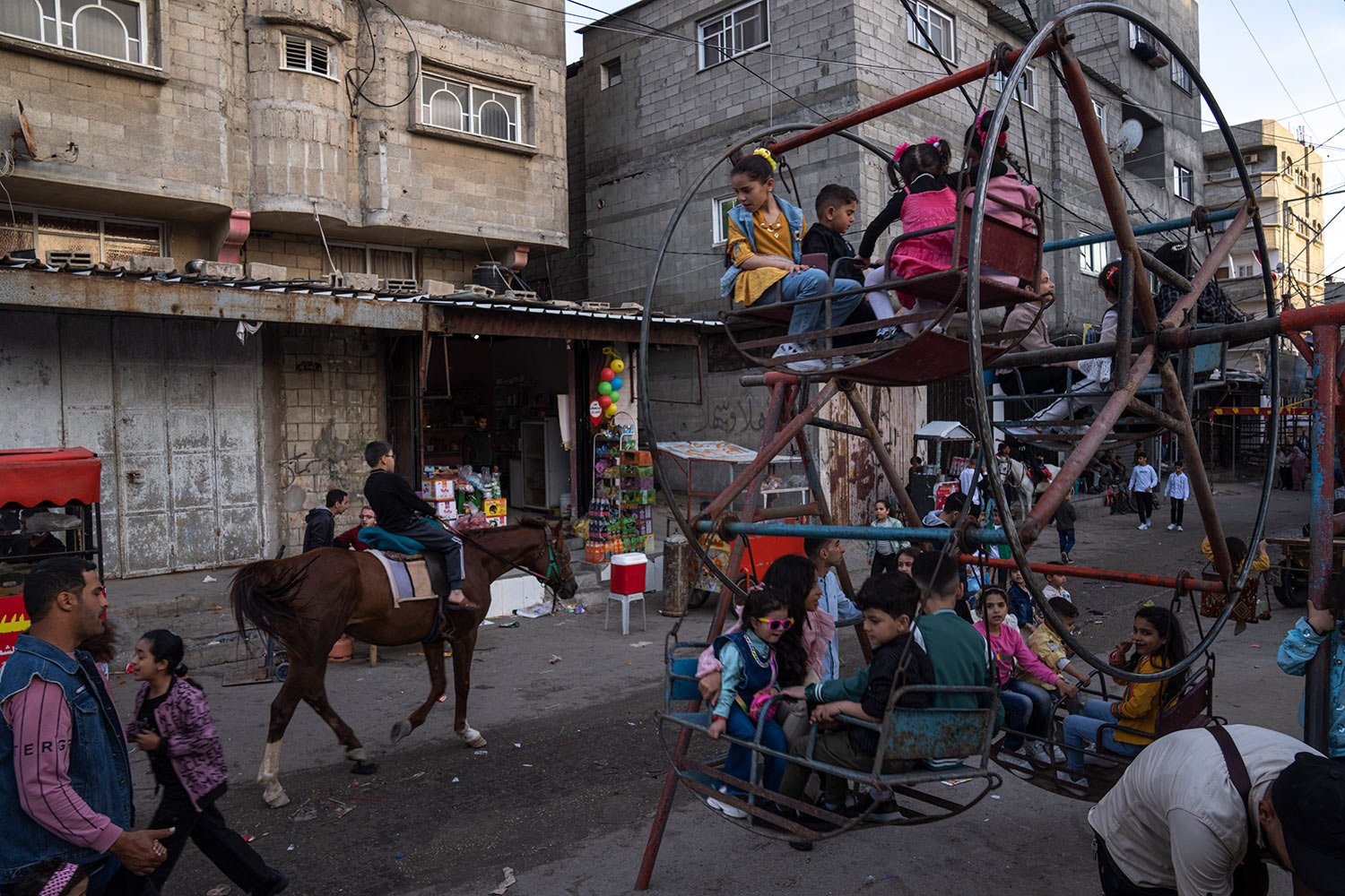  Palestinians celebrate Eid al-Fitr festival, marking the end of the fasting month of Ramadan at al-Shati refugee camp, western Gaza Strip, Saturday, April 22, 2023. (AP Photo/Fatima Shbair) 