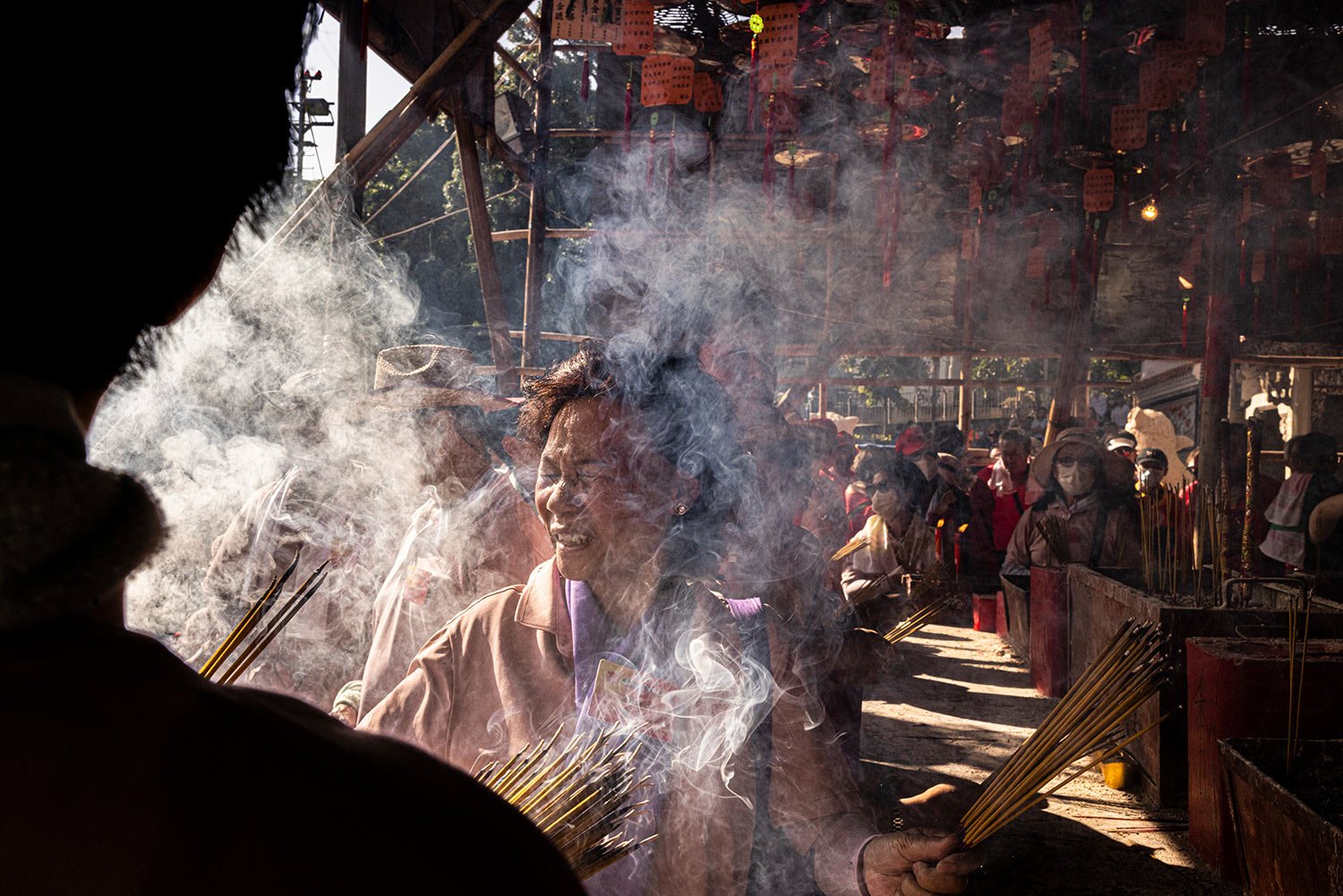  Worshippers burn incense at a temple during the Bun Festival in Cheung Chau Island in Hong Kong, Friday, May 26, 2023. (AP Photo/Louise Delmotte) 