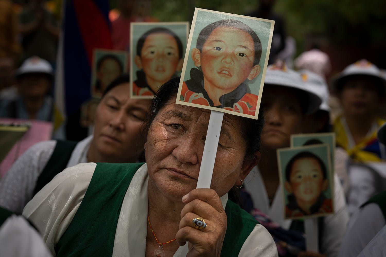  Members of the Tibetan Women's Association hold portraits of the 11th Panchen Lama, Gendhun Choekyi Nyima, as they participate in a protest demanding his release, in New Delhi, India, Wednesday, May, 17, 2023.  (AP Photo/Altaf Qadri) 