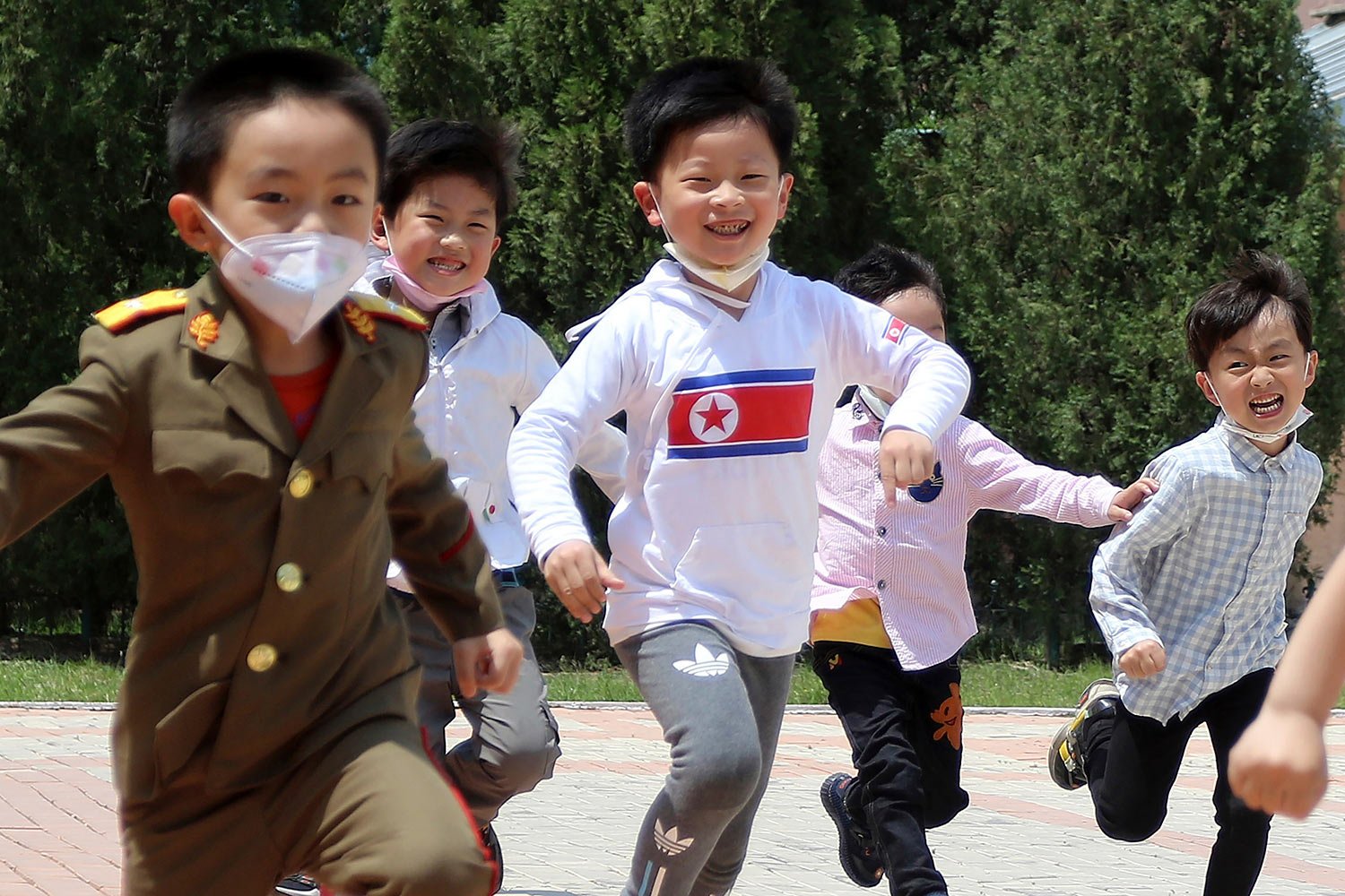  Children run on the playground at the Tongmun kindergarten No.1 in Taedonggang District of Pyongyang, North Kora Tuesday, May 16, 2023. (AP Photo/Jon Chol Jin) 