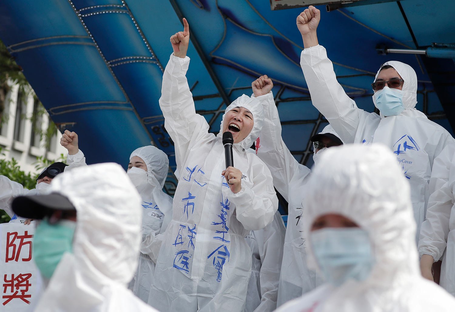  Medical personnel shout slogans during a May Day rally in Taipei, Taiwan, Monday, May 1, 2023.  (AP Photo/Chiang Ying-ying) 