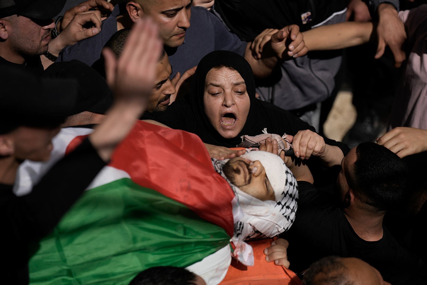  Palestinian mourners carry the body of Said Mesha during his funeral in the Balata refugee camp near the West Bank town of Nablus Saturday, May 13, 2023.  (AP Photo/Majdi Mohammed) 