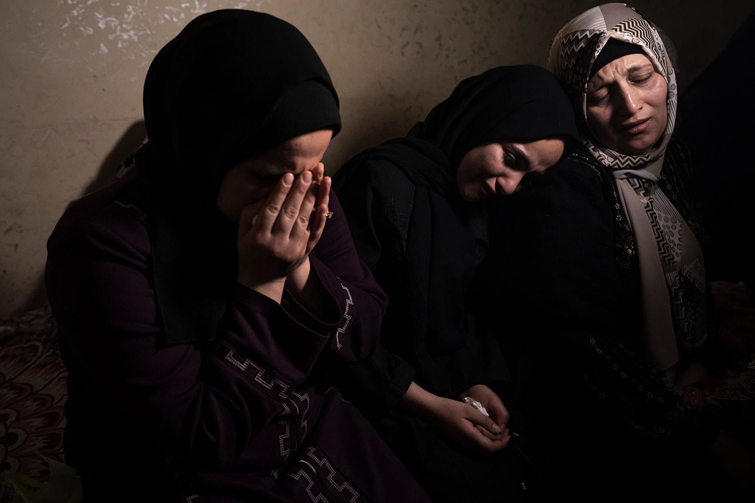  Relatives cry during the funeral of Khalil Bahtini, the Islamic Jihad militant group's commander for the northern Gaza Strip, killed in an Israeli airstrike at their family home in Gaza City, Tuesday, May 9, 2023. (AP Photo/Fatima Shbair) 