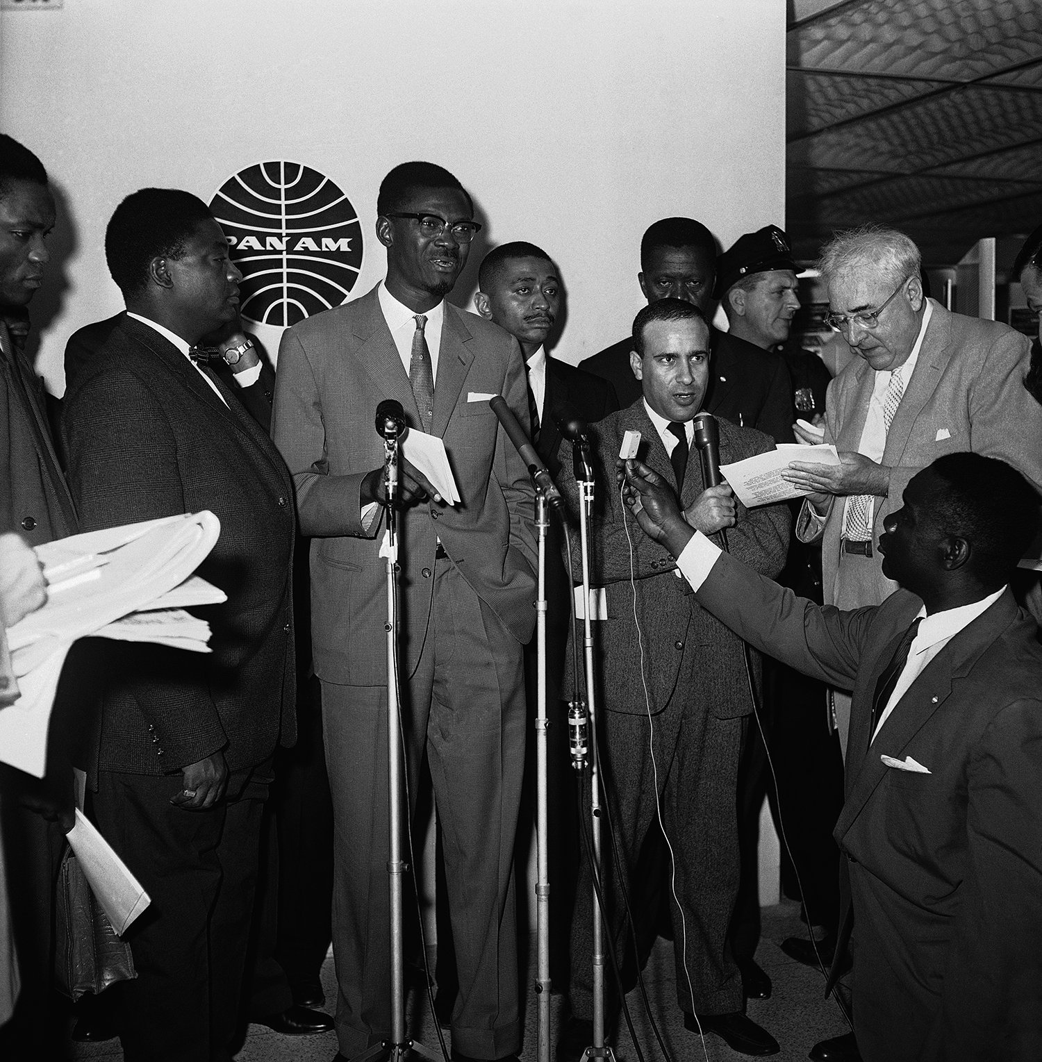  Prime Minister Patrice Lumumba of the Republic of the Congo, makes a statement to broadcasters and reporters at New York's Idlewild Airport on Aug. 2, 1960, before flying to London. (AP Photo/John Rooney) 